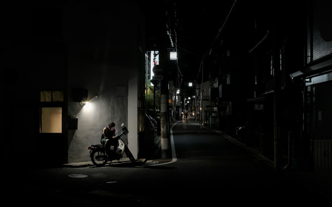 shadowy figure in dark alley